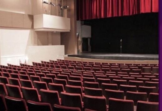 Seminole Theatre main auditorium with red seats and stage