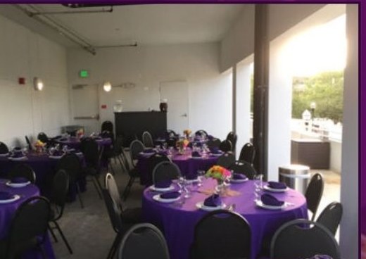 Terrace at the Seminole Theatre set with purple linens for a banquet event